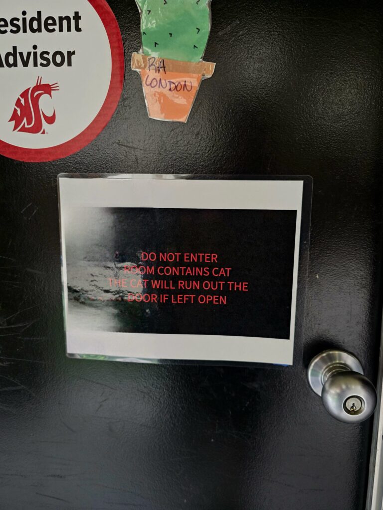 College dorm door sign warning about emotional support cat Luna inside for bringing cat to college safety